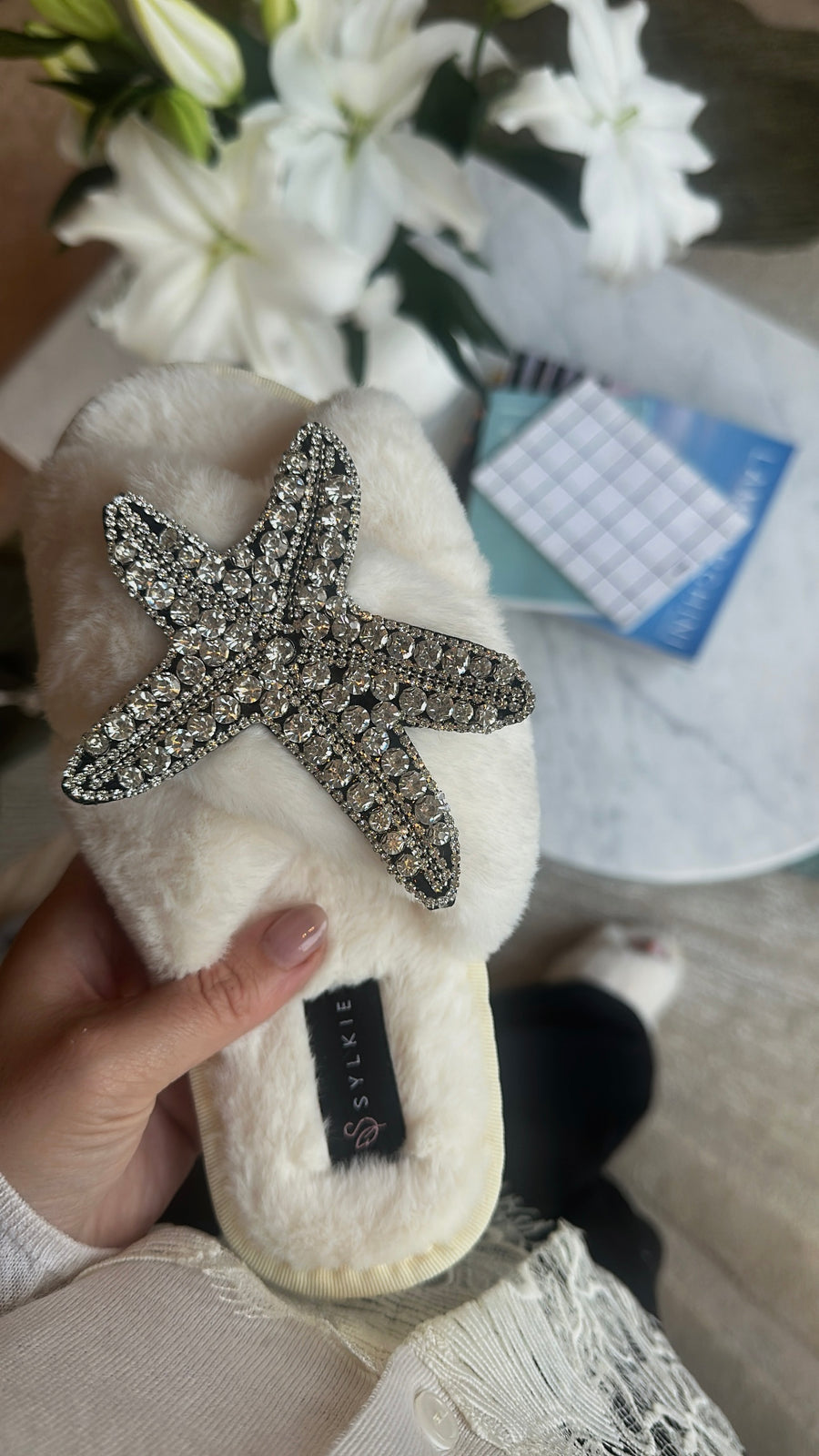 Slipper with brooch