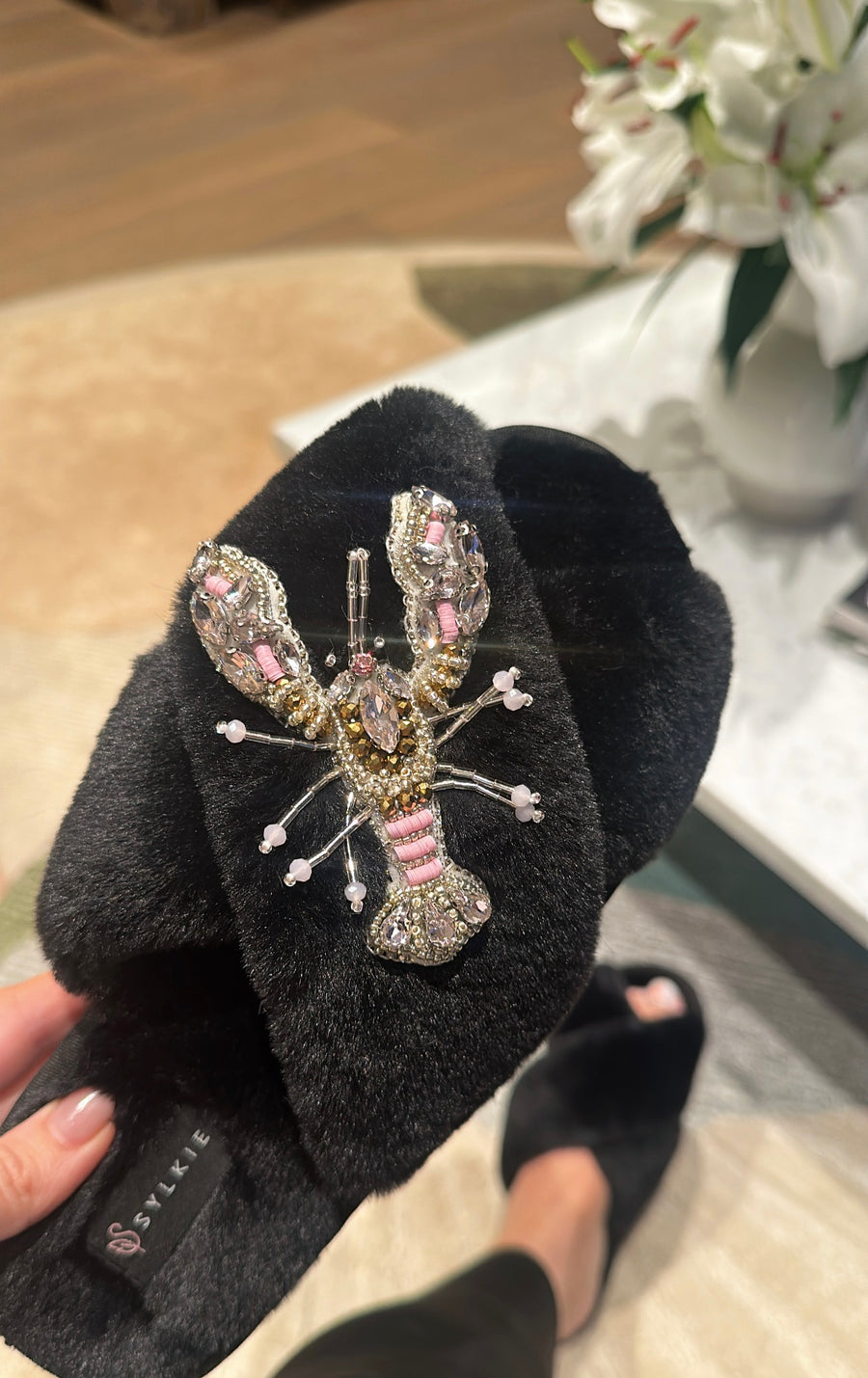 Slipper with brooch