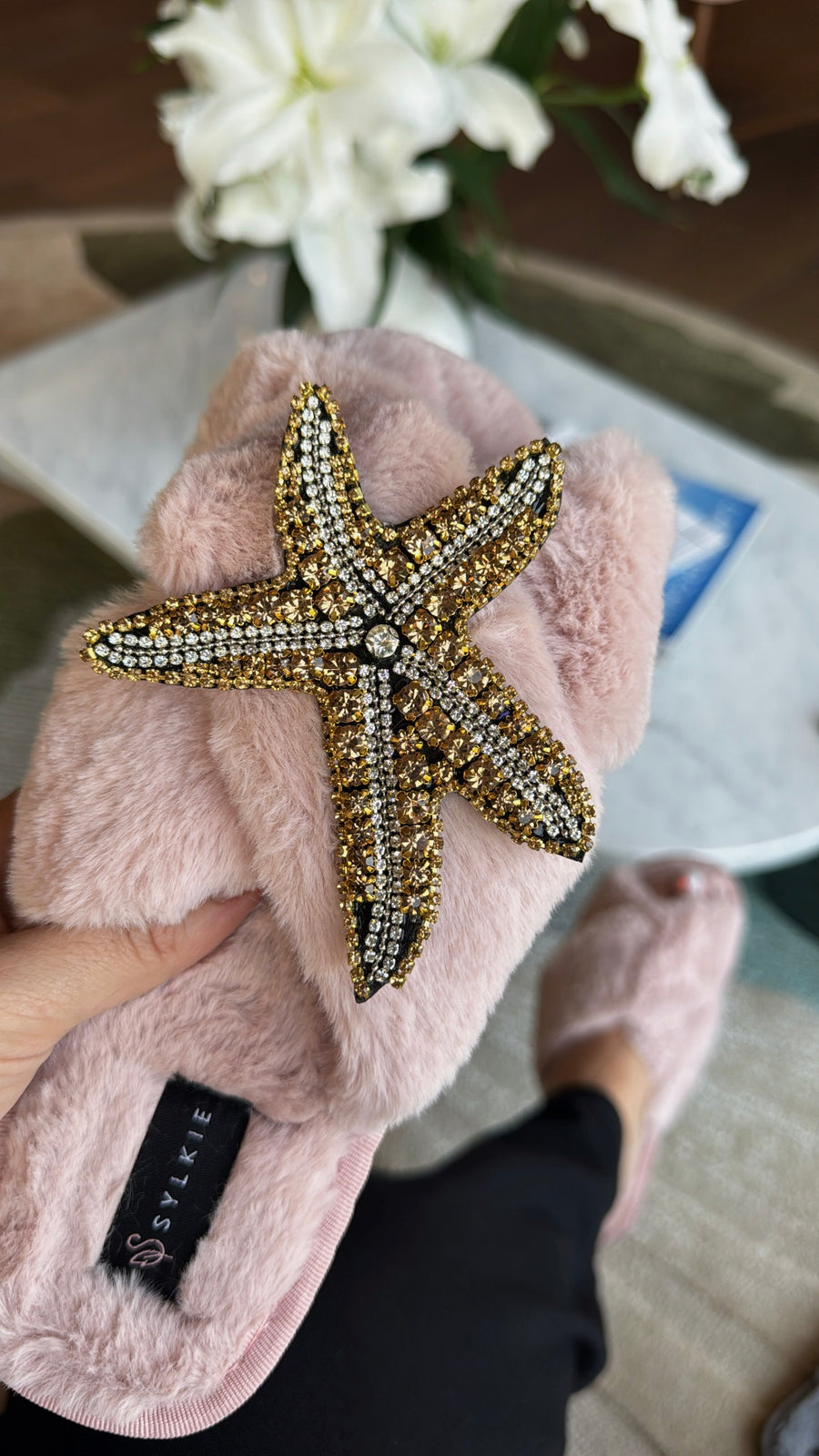 Slipper with brooch