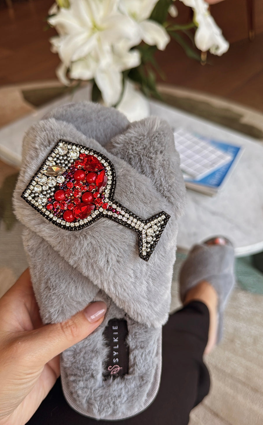 Slipper with brooch