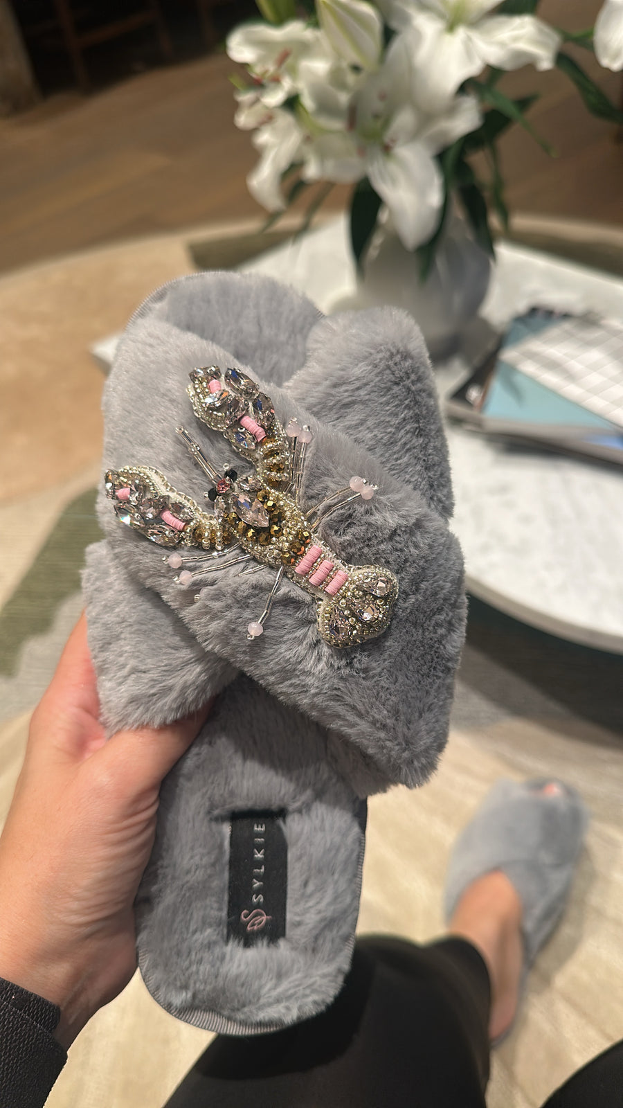 Slipper with brooch