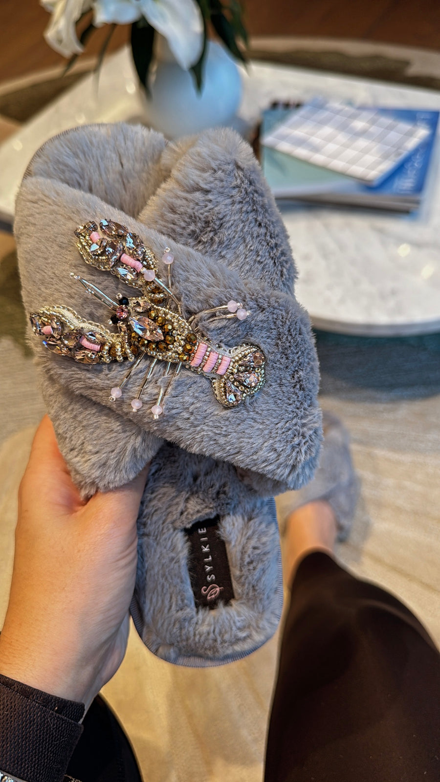 Slipper with brooch