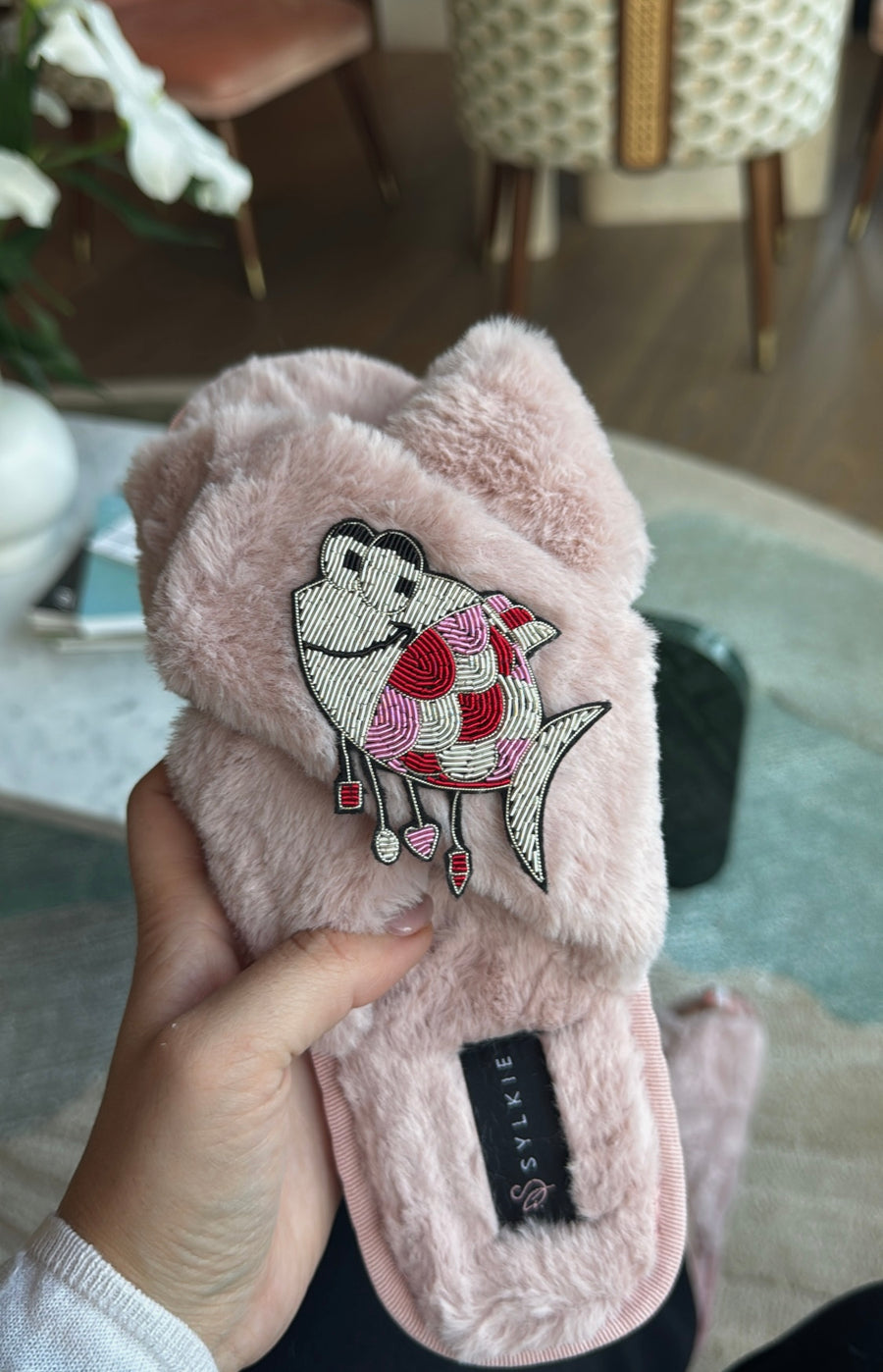 Slipper with brooch