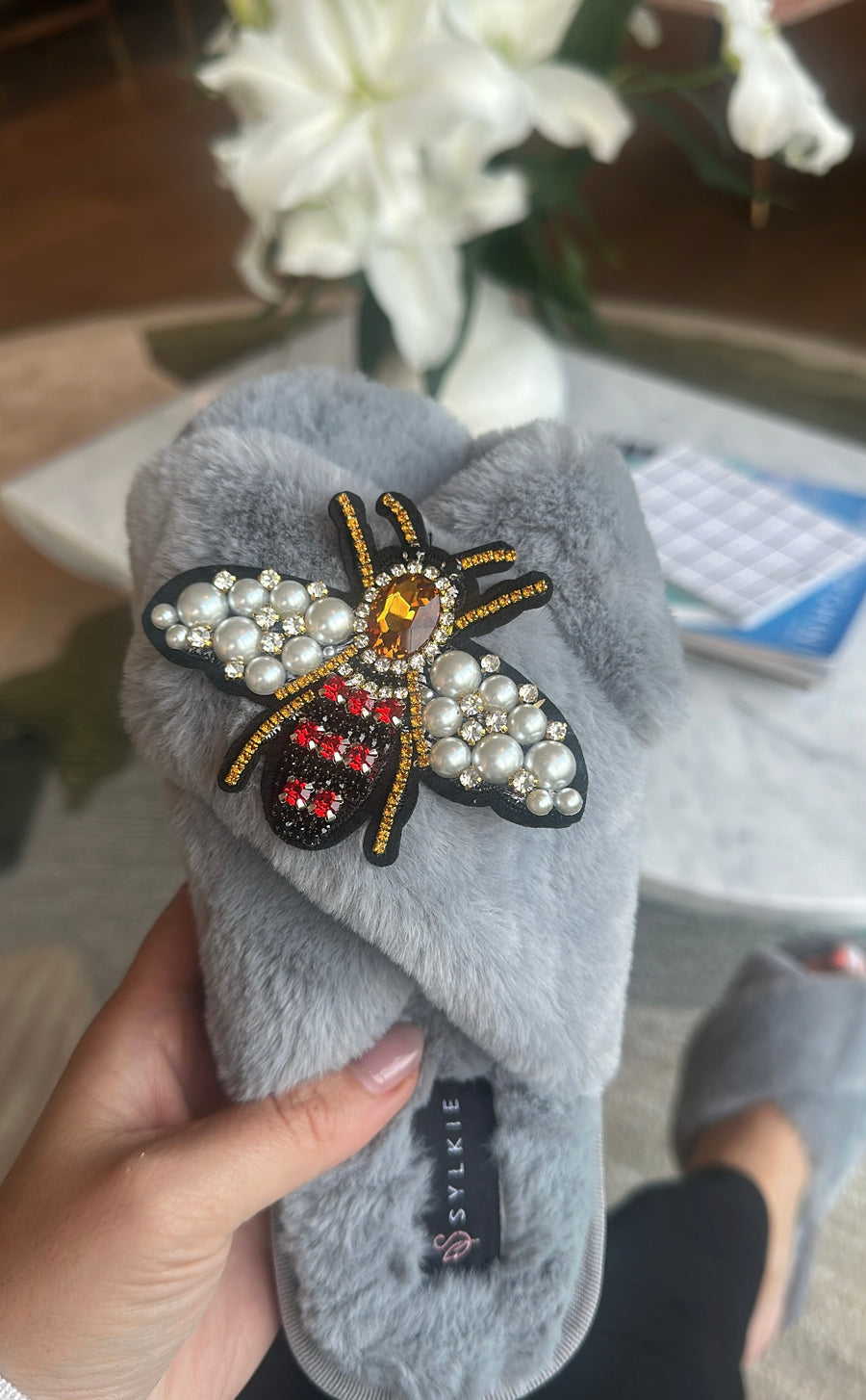 Slipper with brooch