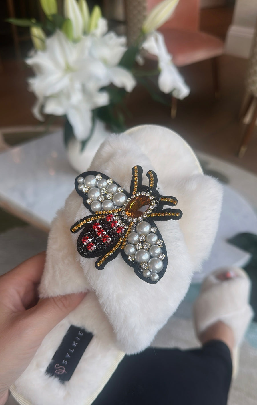 Slipper with brooch