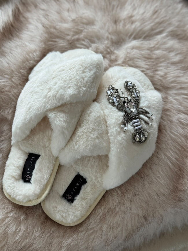 Slipper with brooch