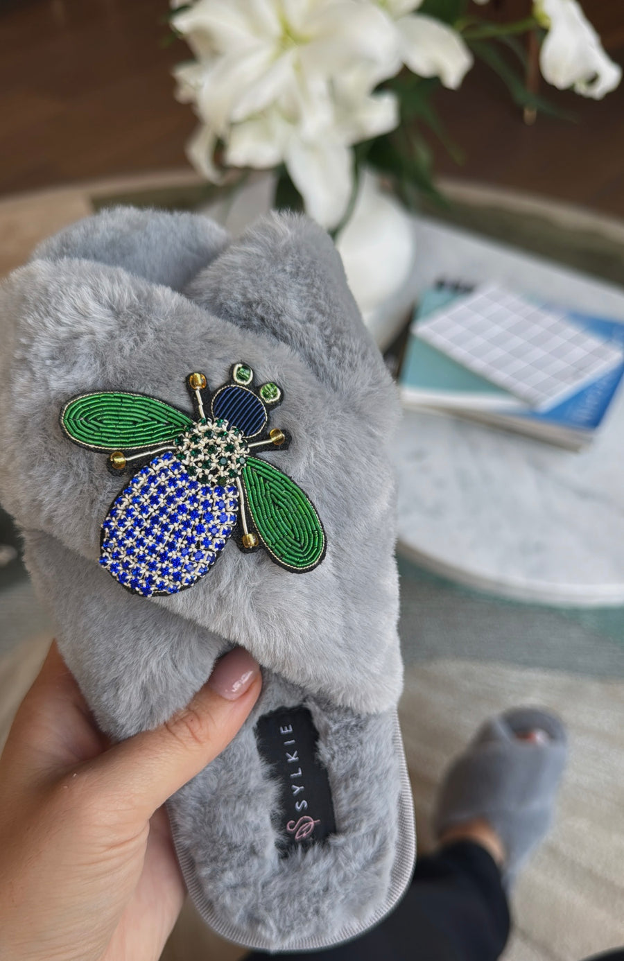 Slipper with brooch