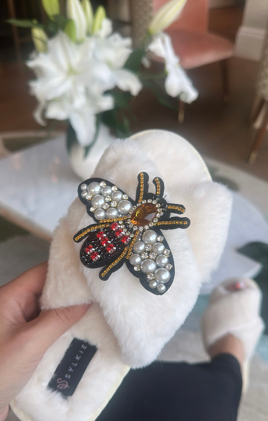 Slipper with brooch